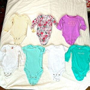 Carter’s bundle of 7 baby girl size 6 month onesies. 5 long sleeve and 2 short.
